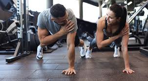 Fitness trainer demonstrating arm toning exercises Portsmouth 