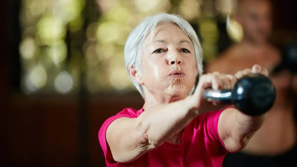 Woman doing resistance band exercises for toned arms Portsmouth 